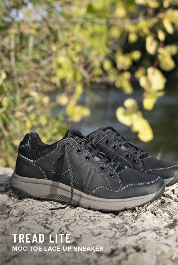 Shoes for Men view all category. Image features the Tread Lite sneaker in black. 