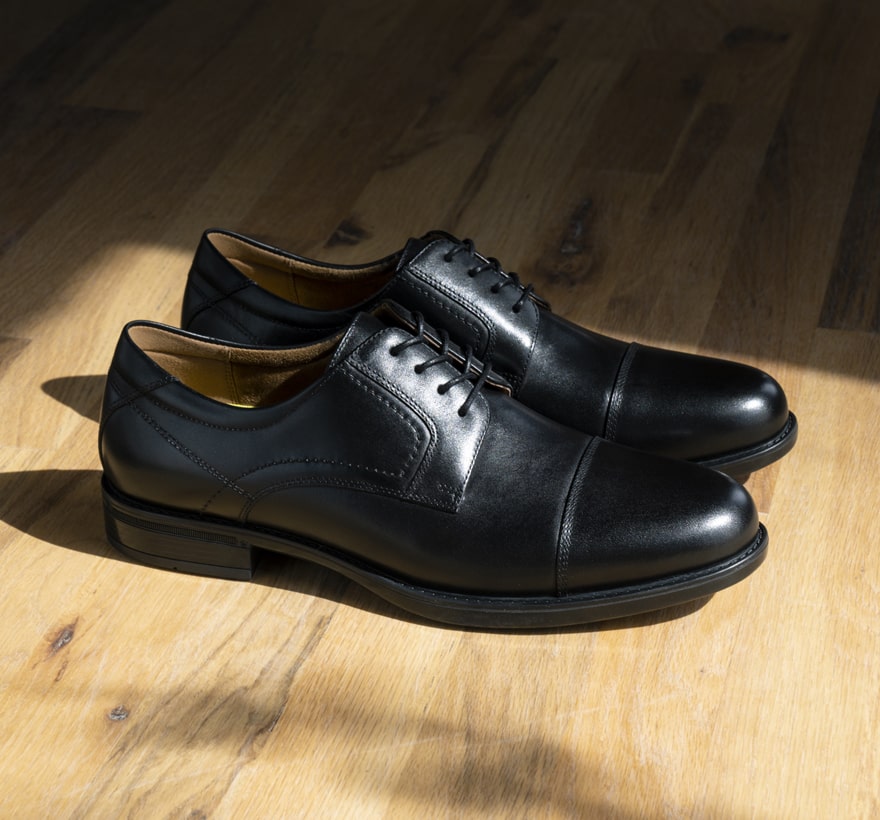 Click to shop Florsheim top sellers. Image features the Midtown cap toe in black.