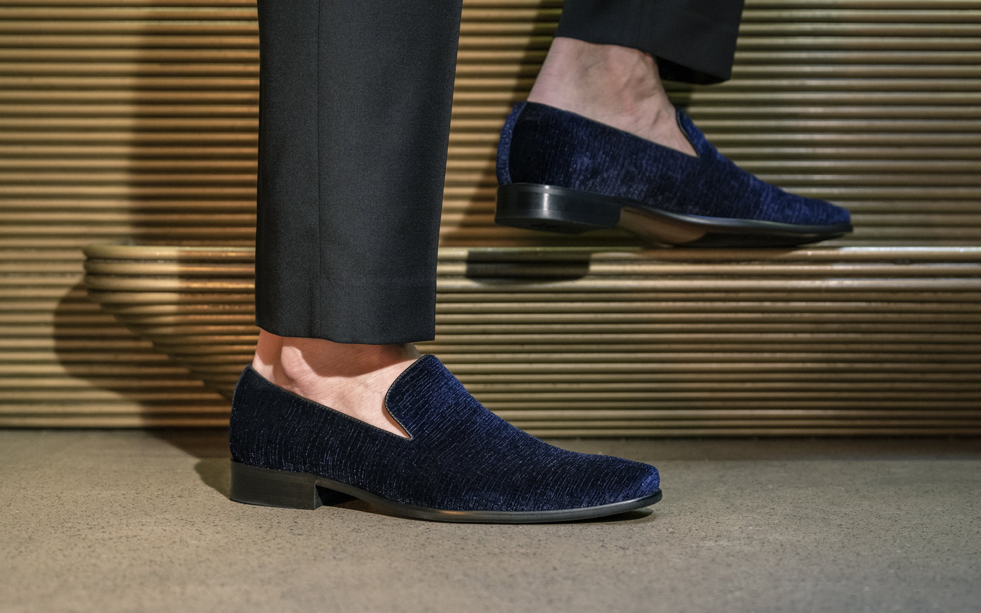 Click to shop the Florsheim Postino velvet slip on. Image features the shoe in navy.