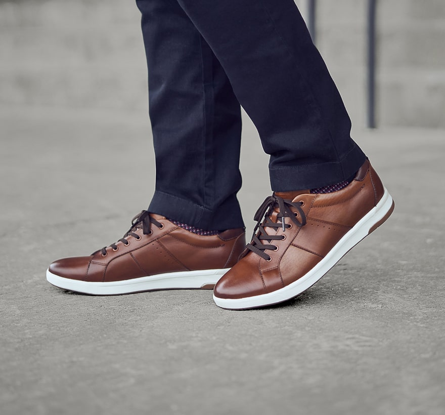 Click to shop Florsheim sneakers. Image features the Crossover in cognac. 