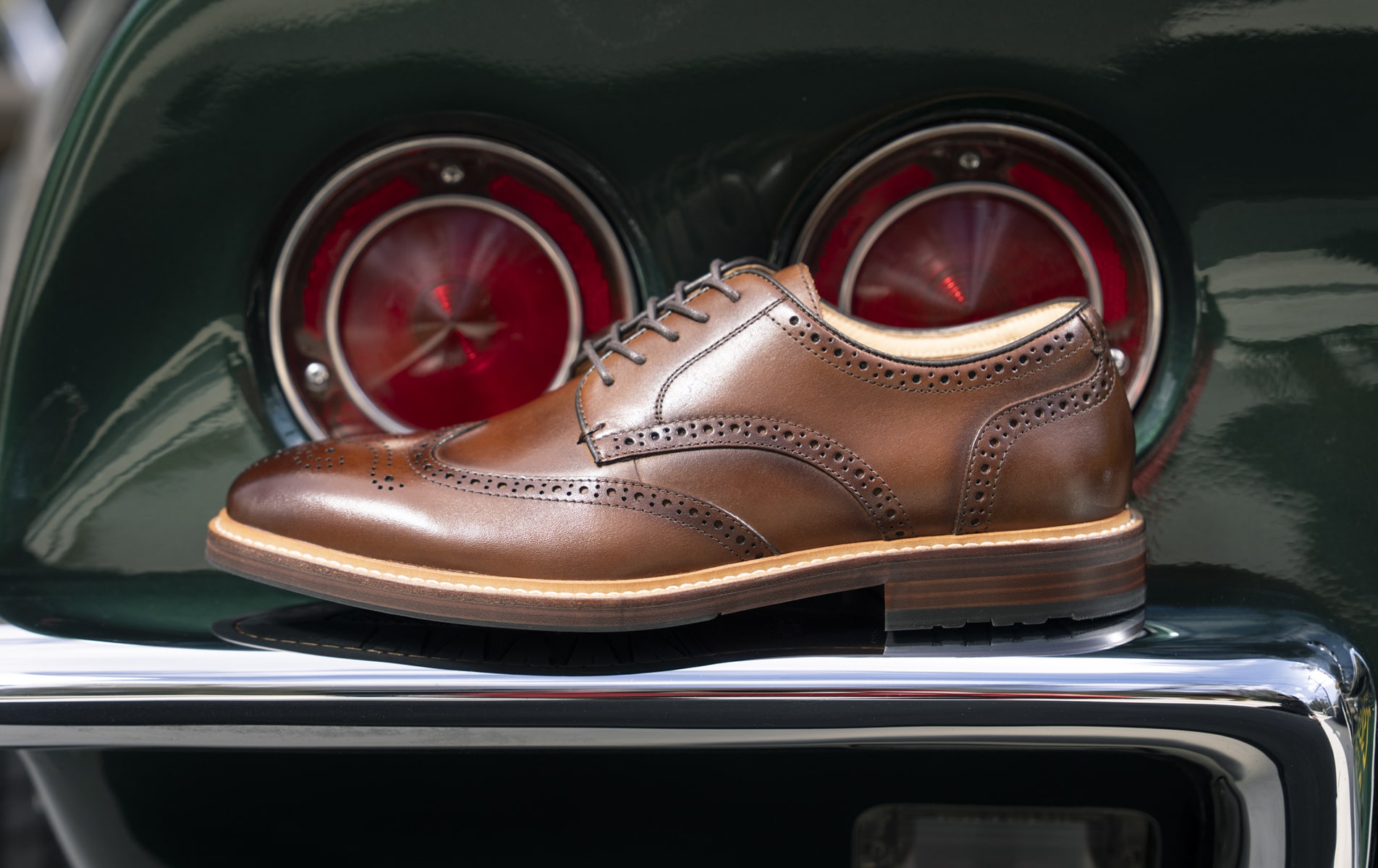 Shop Florsheim dress featuring the Anthem wingtip on a green car.