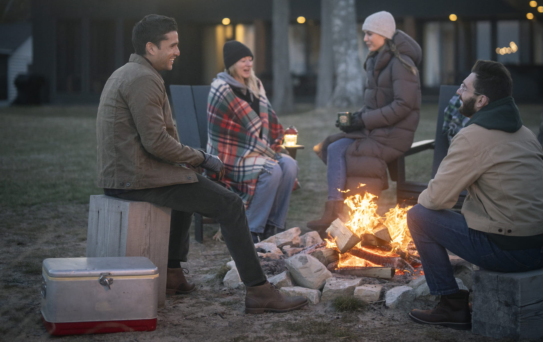Shop Florsheim casuals featuring the Lodge 3 Eye Chukka in brown by a bonfire. 
