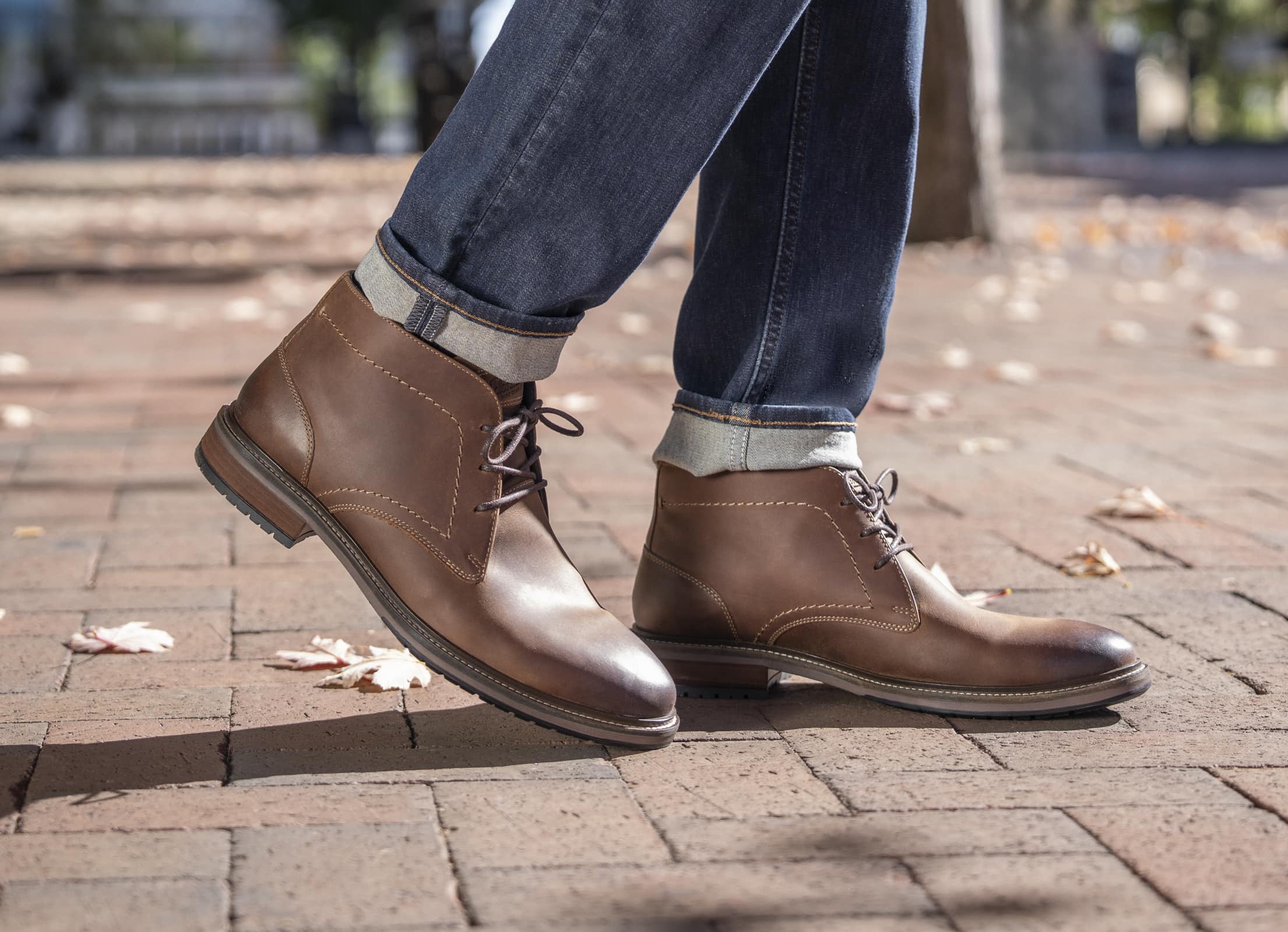Shop Florsheim new arrivals featuring the Forge chukka boot on a brick street.