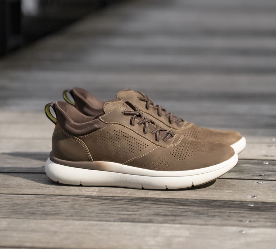 Shop the Florsheim Top Sellers category featuring the Fleet in Cognac on a wooden background.