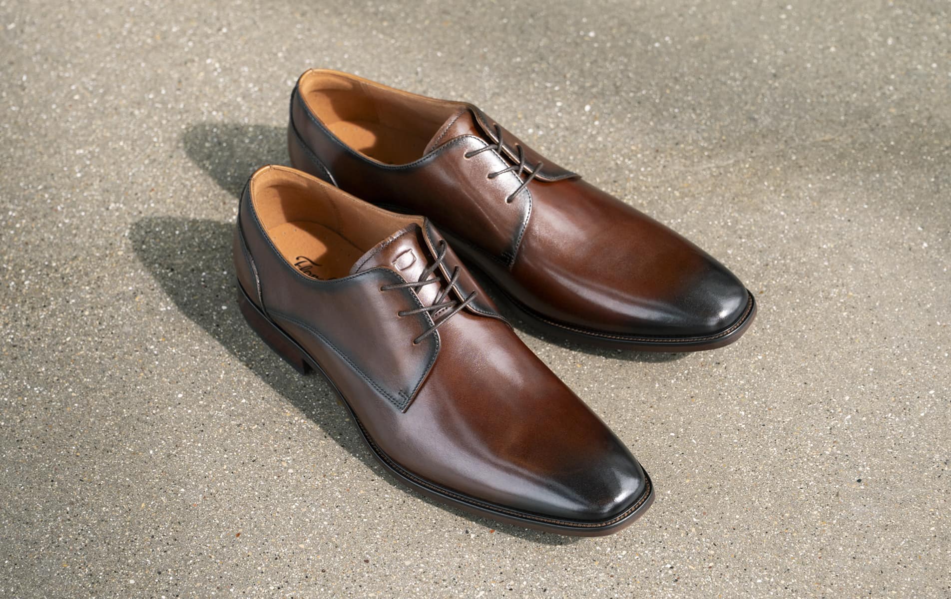 Shop the Florsheim Dress Category featuring the Sorrento Lux in brown on a concrete background