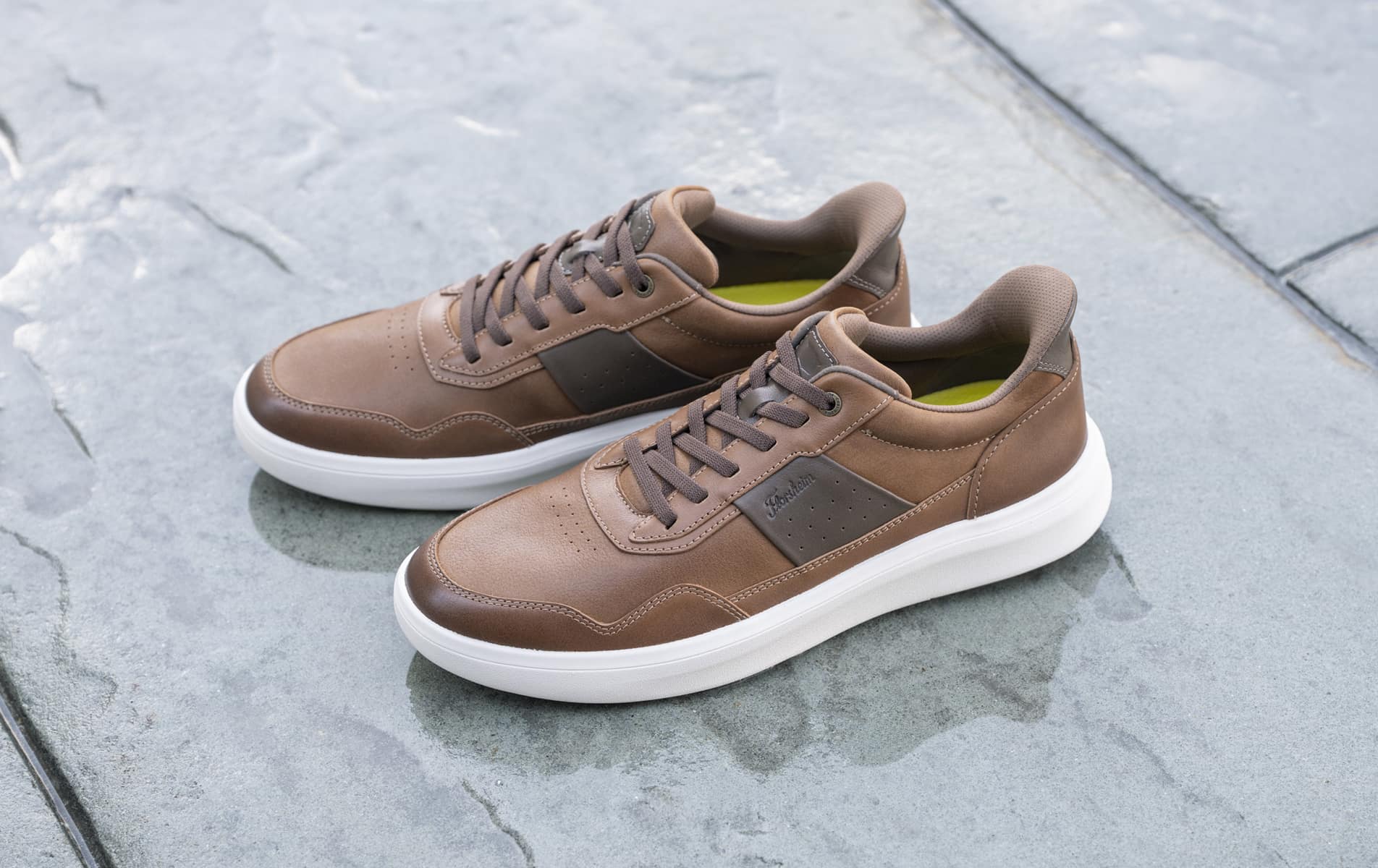 Shop Florsheim's Casual category featuring the Crosstour Casual Lace Up Hands Free in Cognac on stone tile floors.