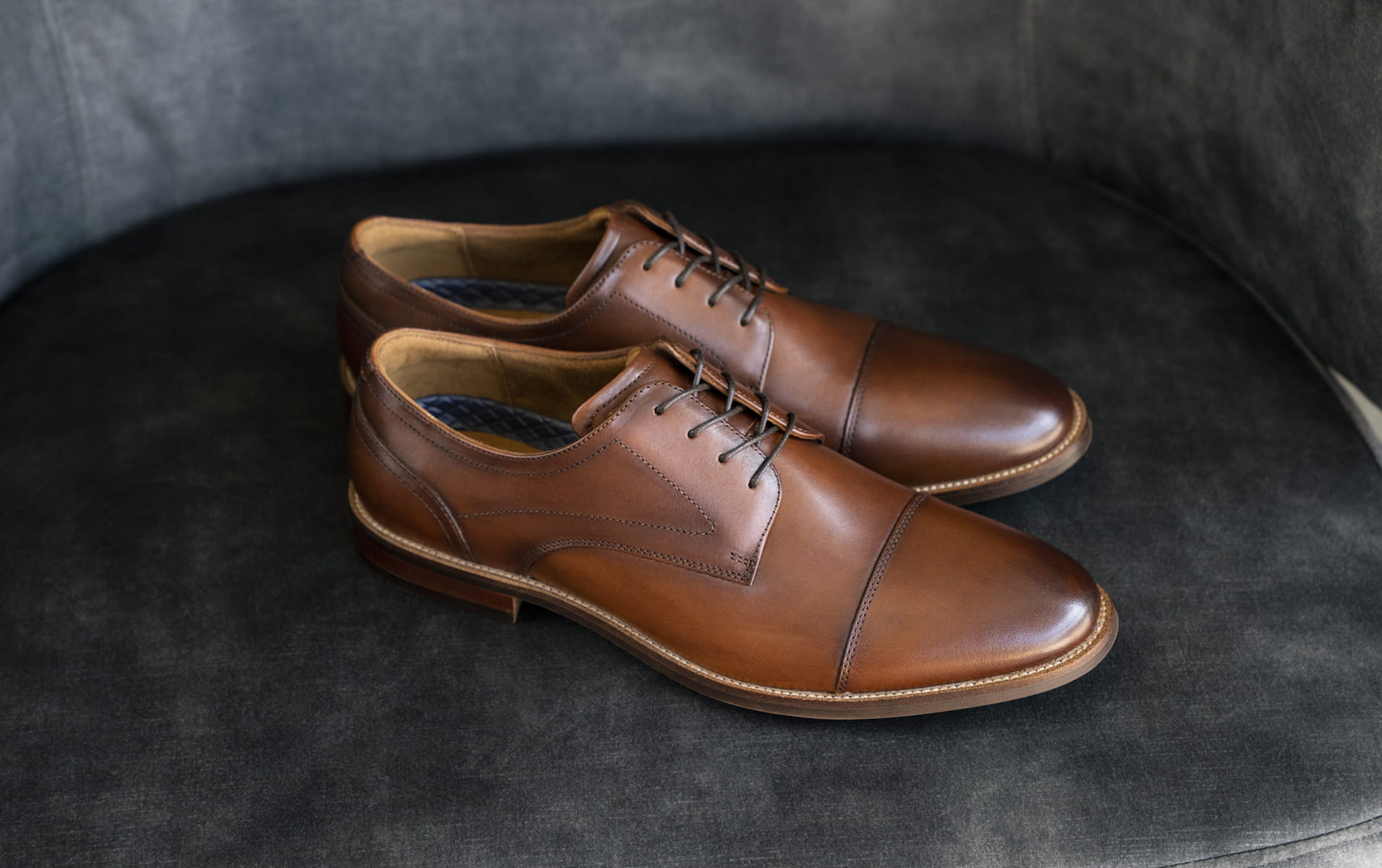 Click to shop Florsheim dress shoes. Image features the Rucci in cognac.