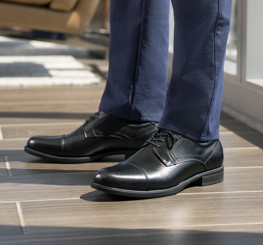 Click to shop Florsheim top sellers. Image features the Midtown cap toe in black.