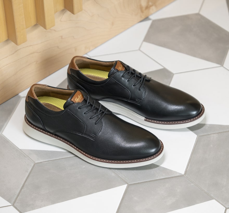 Image features the Launch plain toe oxford in black.