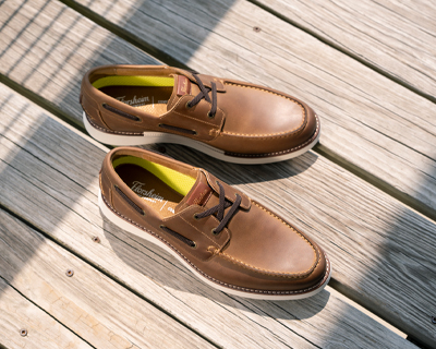 Image features the Launch Moc Toe Elastic Lace Boat Shoes in Brown CH.