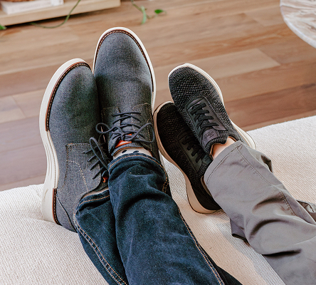 Shop Florsheim Father's Day Picks featuring a man and kids feet propped up on an ottoman.