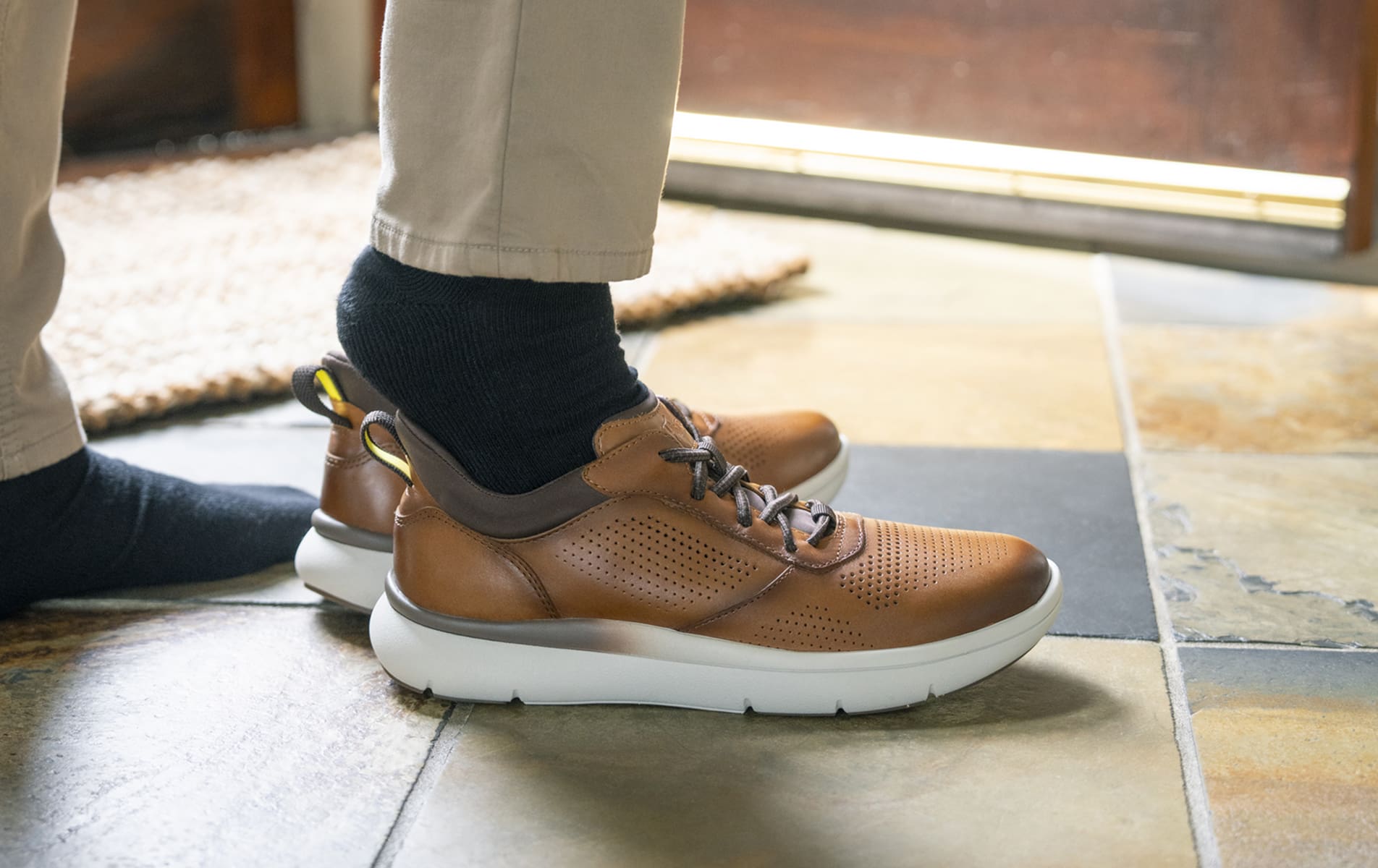 Shop Florsheim casuals featuring the Fleet hands free sneaker on a tile floor.