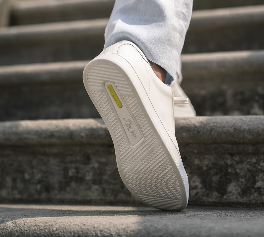 Shop Florsheim Comfortech styles featuring the Comfortech footbed walking up concrete stairs.