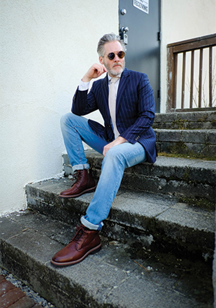 November 2021: President of the Garner Chamber of Commerce and fashion enthusiast Matthew Coppedge sits outside in our Norwalk Plain Toe Lace Up Boot in Garner, North Carolina. 