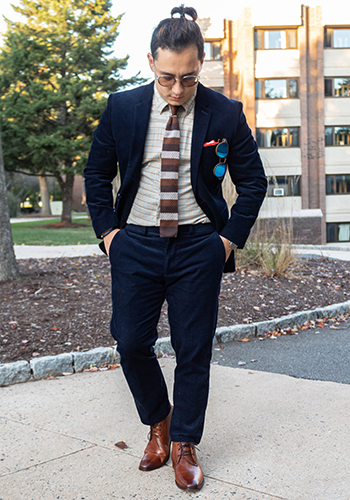 Image of social media influencer David Arango walking outside in the Sorrento Plain Toe Chukka Boot in Cognac.