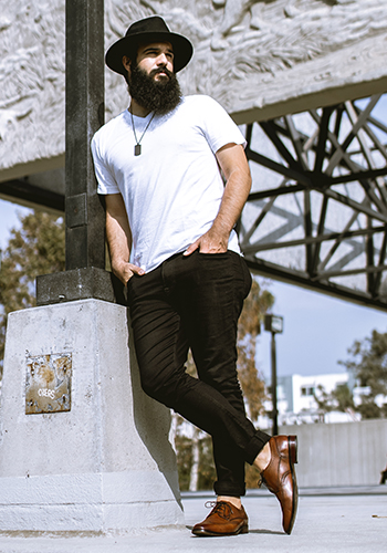 Image of social media influencer Anthony Mastracci standing outside in the Sorrento Wingtip Oxford in Cognac.