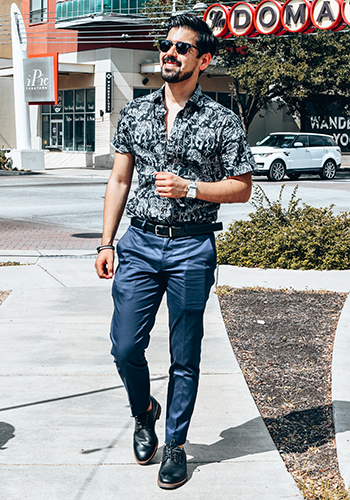 Image of social media influencer Cristobal Benavides walking outside in the Lodge Plain Toe Oxford in Black Crazy Horse.