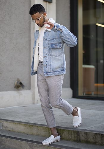 Image of social media influencer Christopher Chin walking down steps in the Sportster Moc Toe Venetian Slip On in White.