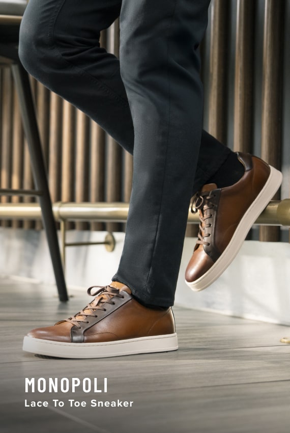 Shoes for Men view all category. Image features the Monopoli lace to toe sneaker in cognac.