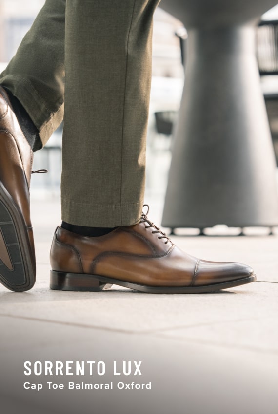 Men's Dress Shoes category. Image features the Sorrento Lux oxford in cognac.