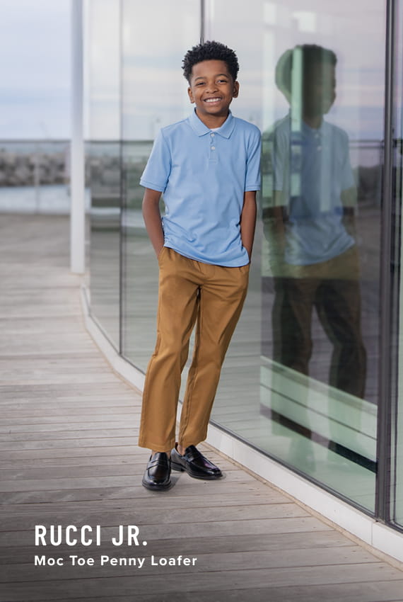 Kids Shoes view all category. Image features the Rucci Jr. Penny Loafer in black.