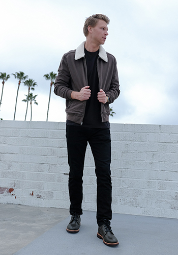 Image of socal media influencer Drew Mellon wearing the Foundry Plain Toe Chukka Boot in Army Green in California.