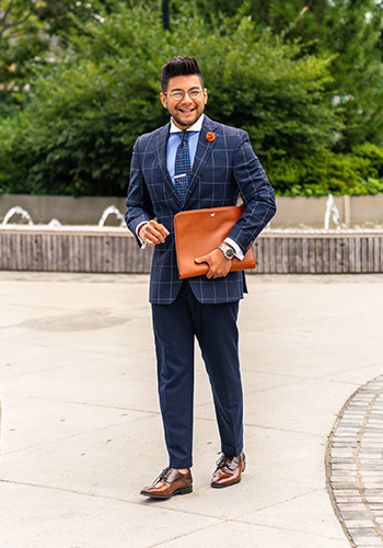 Image of social media influencer Diego Leon wearing the Belfast Medalion Toe Oxford in Cognac Multi in a park.