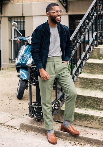 Image of social media influencer Brandon Bryant on a staircase wearing the Heads Up Moc Toe Penny Loafer in Cognac.