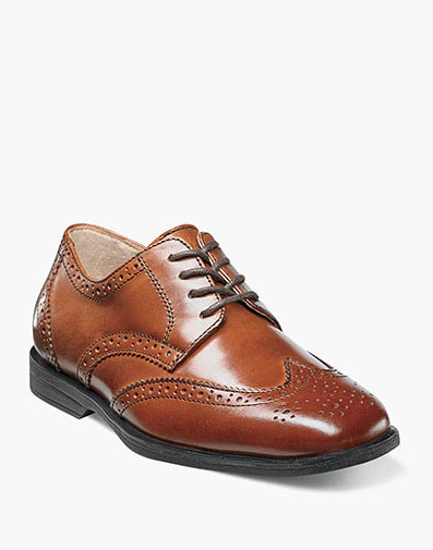 The featured product is the Reveal Jr. Wingtip Oxford in Cognac.